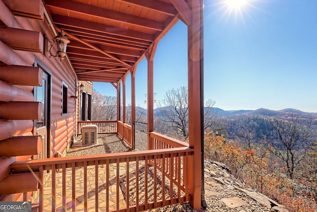 wooden terrace featuring a mountain view