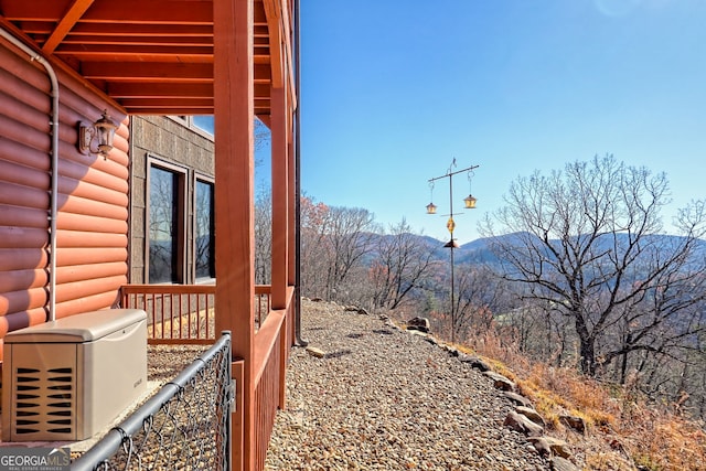 view of side of home with a mountain view