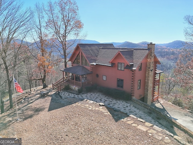 view of side of property with a mountain view