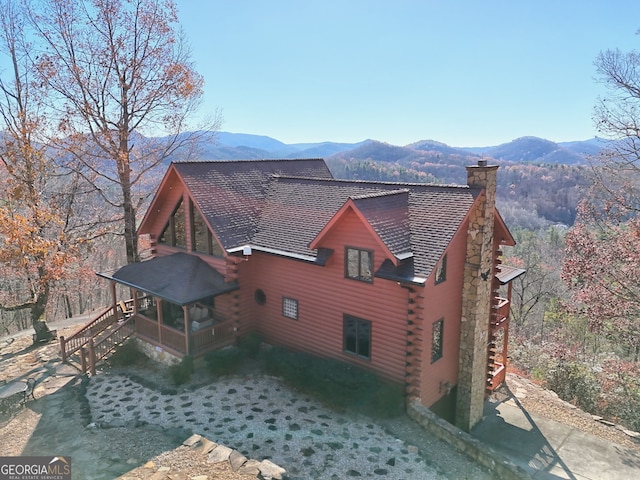 back of house with a mountain view