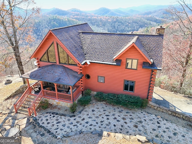 back of house featuring a mountain view