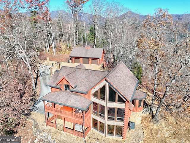 birds eye view of property with a mountain view