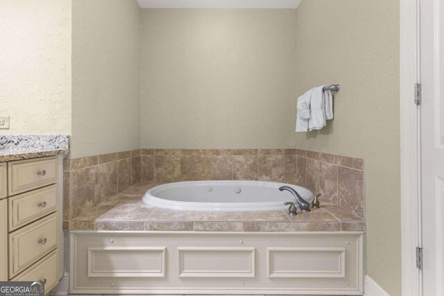 bathroom featuring vanity and a bathing tub