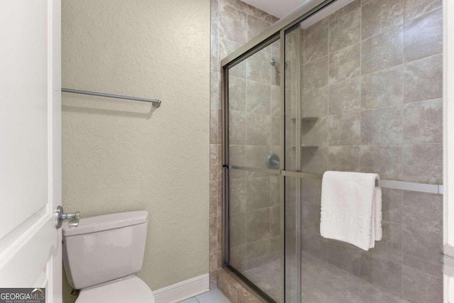 150 Salt Air Dr Unit 310, Saint Simons, GA 31522 - full bathroom with a shower stall and a textured wall