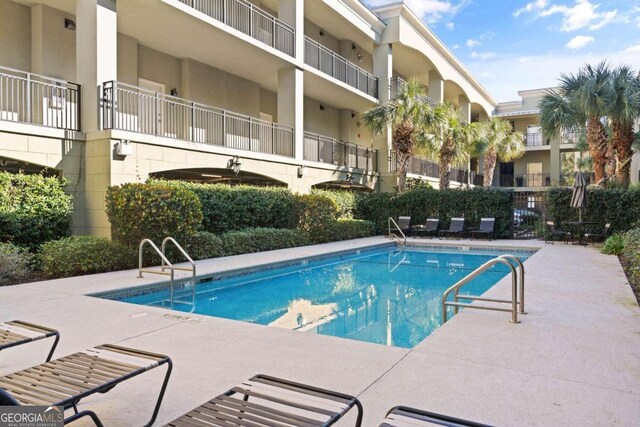 view of swimming pool with a patio area