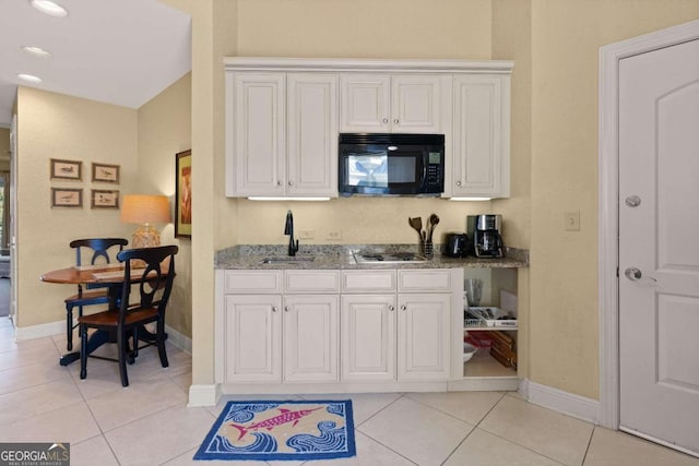 kitchen with white cabinetry, sink, light tile patterned floors, and stainless steel gas stovetop