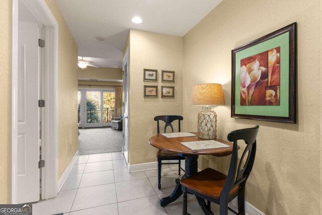 hallway featuring light tile patterned floors