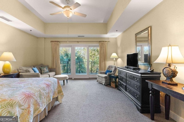 150 Salt Air Dr Unit 310, Saint Simons, GA 31522 - carpeted bedroom with access to exterior and a raised ceiling