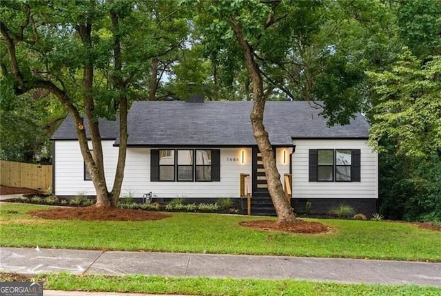 view of front of home with a front yard