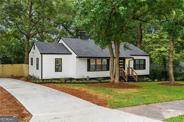 view of front of property with a front lawn