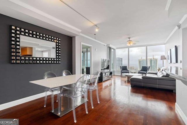 dining space featuring dark hardwood / wood-style floors, ceiling fan, and ornamental molding