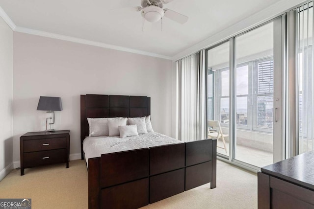 carpeted bedroom with ceiling fan, crown molding, and access to outside