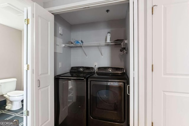 laundry room featuring separate washer and dryer