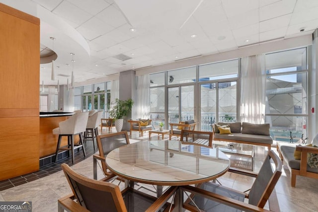 tiled dining room with plenty of natural light