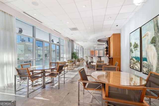 dining room with light tile patterned flooring