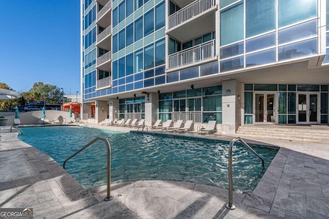 view of swimming pool with a patio