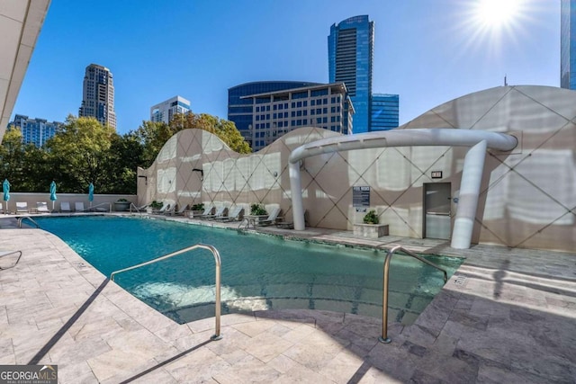 view of swimming pool with a patio area