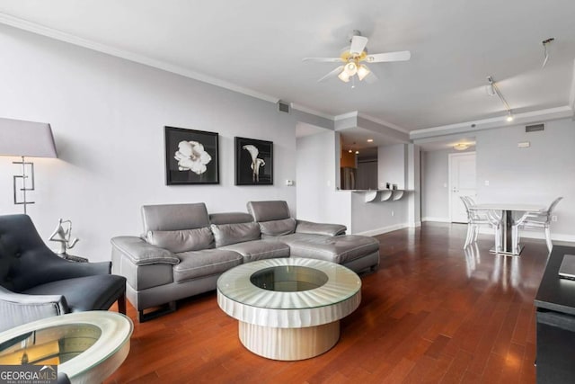 living room featuring wood-type flooring, ceiling fan, and ornamental molding