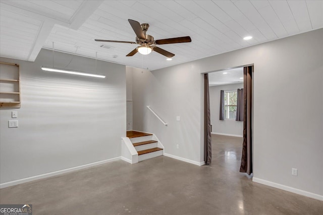 spare room with concrete floors and ceiling fan