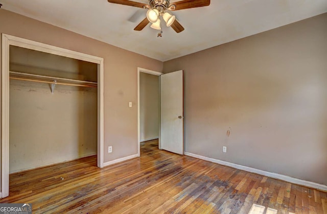 unfurnished bedroom featuring a closet, ceiling fan, and hardwood / wood-style floors