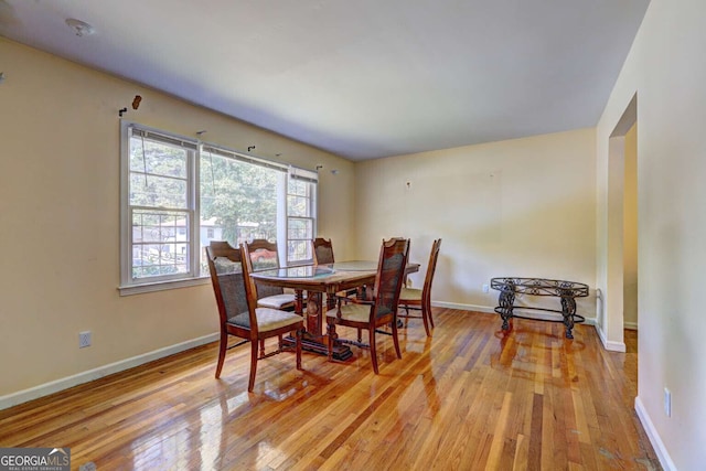 dining space with light wood-type flooring