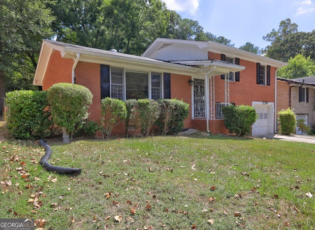 view of front facade featuring a garage and a front lawn