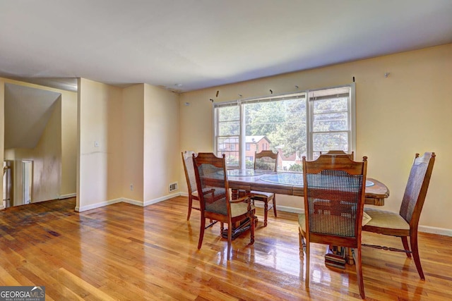 dining area featuring hardwood / wood-style floors