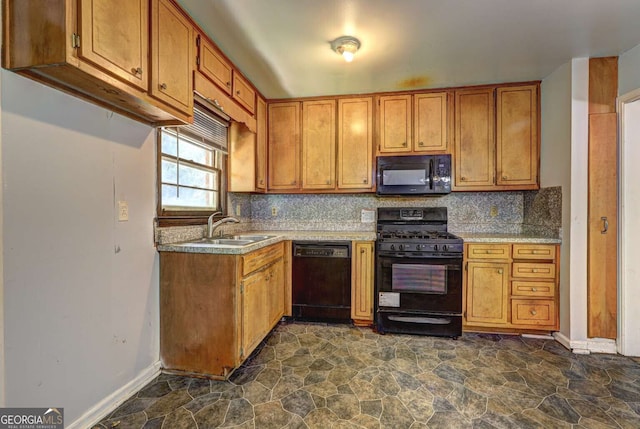 kitchen with black appliances, decorative backsplash, light stone countertops, and sink