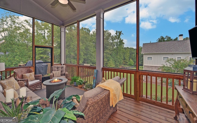 sunroom / solarium featuring ceiling fan and lofted ceiling