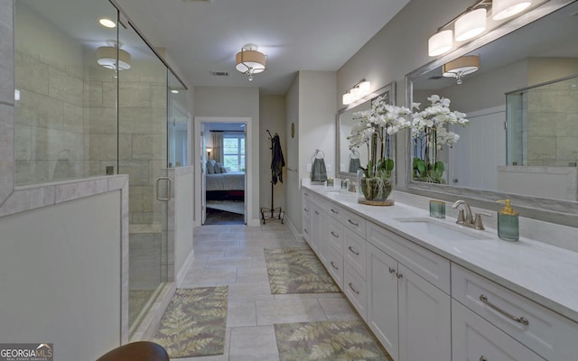 bathroom featuring vanity and a shower with door