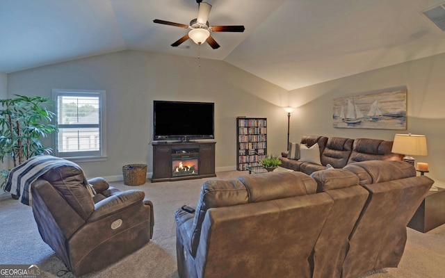 living room featuring ceiling fan, carpet, and lofted ceiling