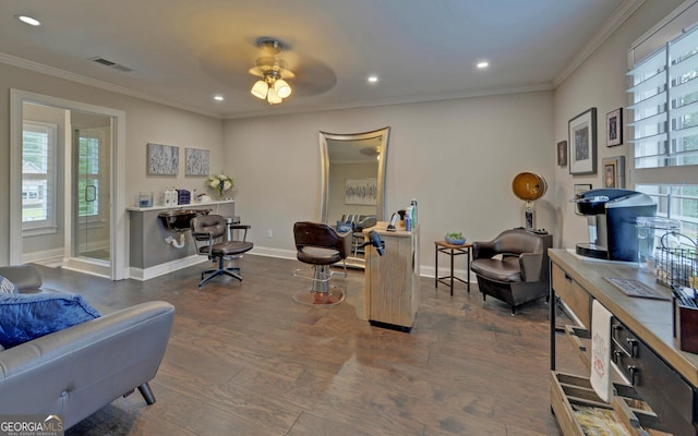 office area with crown molding, dark hardwood / wood-style flooring, and ceiling fan