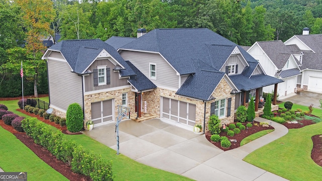 view of front of house featuring a front lawn and a garage