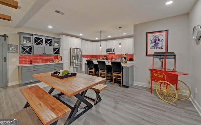 dining room with light hardwood / wood-style flooring