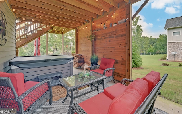 view of patio / terrace with an outdoor hangout area and a hot tub