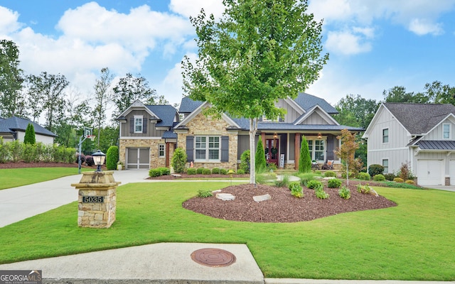 craftsman-style home featuring a front yard and a garage