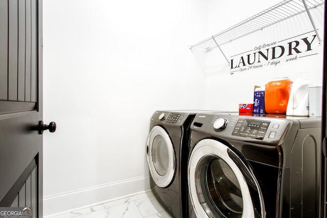 laundry area featuring washing machine and dryer