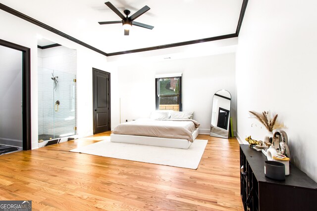 bedroom with light hardwood / wood-style floors, ceiling fan, and crown molding