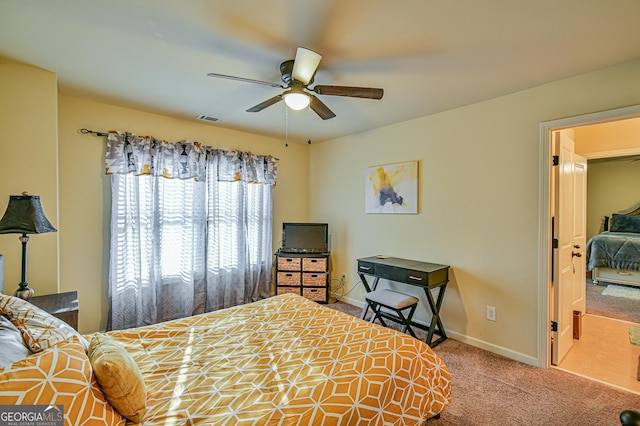 carpeted bedroom with ceiling fan