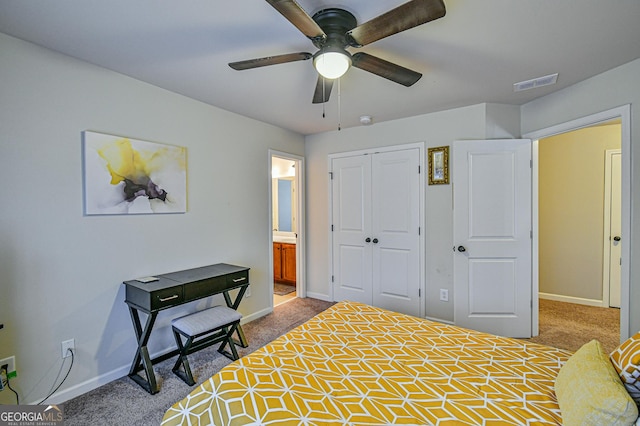 bedroom with carpet flooring, connected bathroom, ceiling fan, and a closet