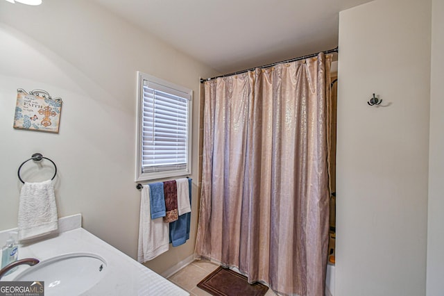 bathroom with tile patterned floors and vanity