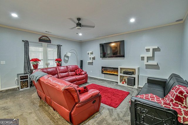 carpeted living room with crown molding and ceiling fan