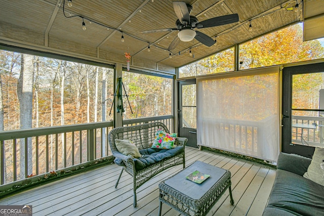 sunroom / solarium featuring vaulted ceiling and ceiling fan