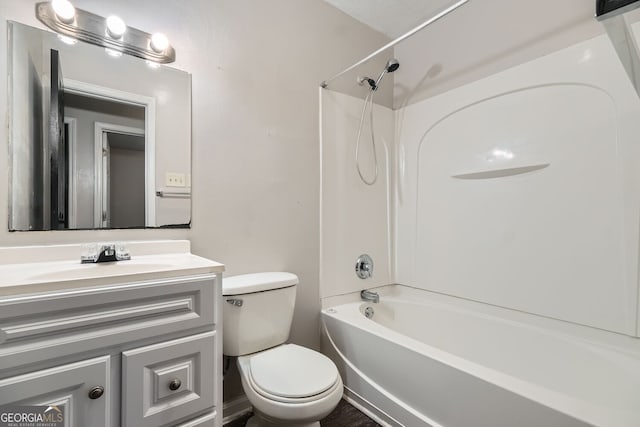 full bathroom featuring toilet, vanity, and tub / shower combination