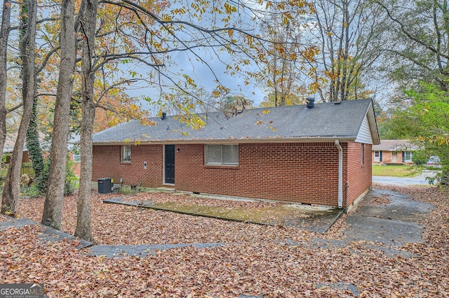 rear view of property with central air condition unit