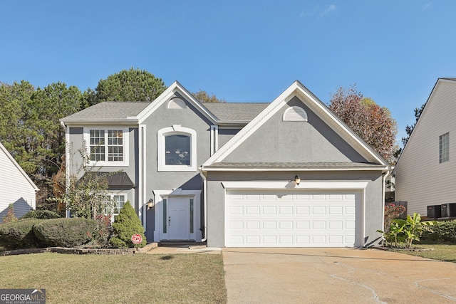 view of front of home with a front yard, a garage, and central air condition unit