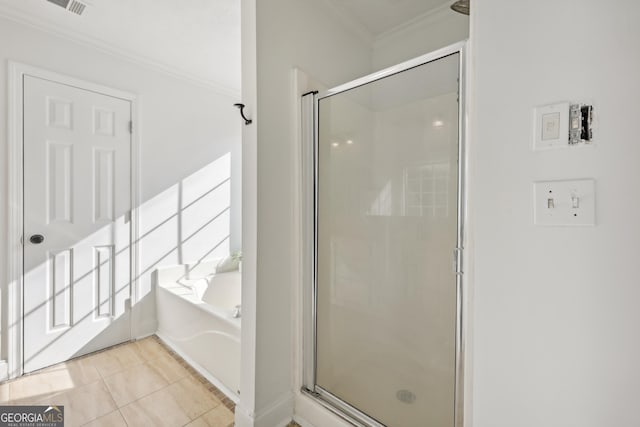 bathroom featuring tile patterned floors, crown molding, and independent shower and bath