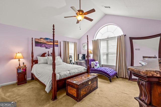 bedroom with light colored carpet, vaulted ceiling, and ceiling fan