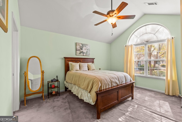 bedroom featuring ceiling fan, light carpet, and lofted ceiling