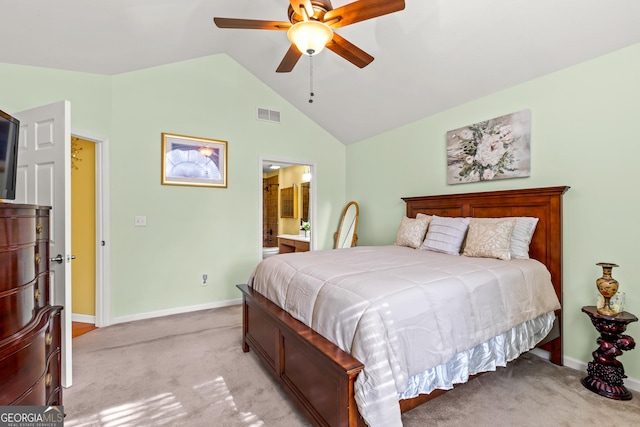 bedroom featuring connected bathroom, ceiling fan, light carpet, and vaulted ceiling